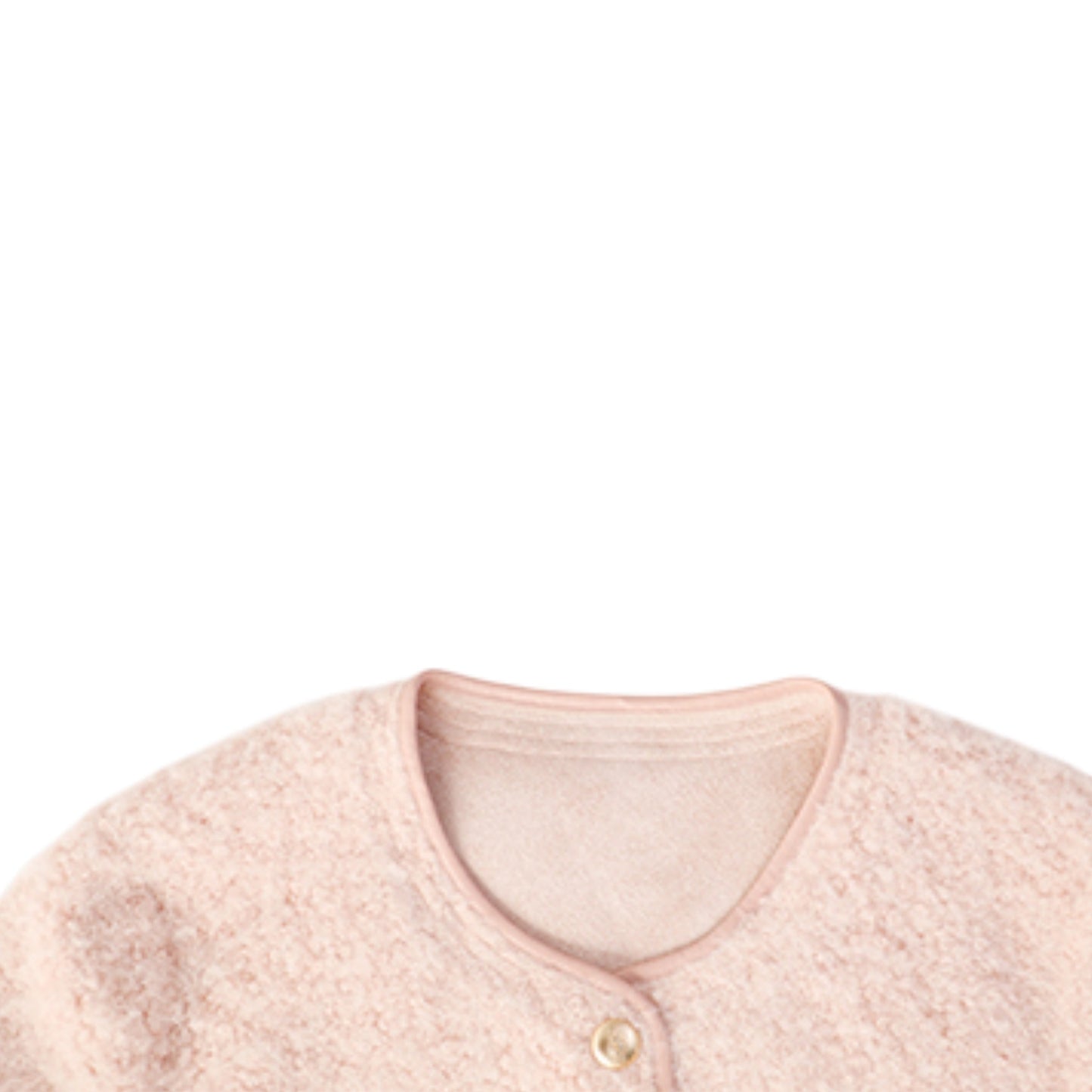 ツイードジャケットのゴールドボタンとブークレ生地のテクスチャを写した拡大写真。